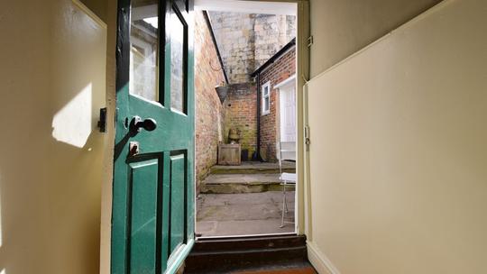 87 Micklegate back door to yard 1201434115