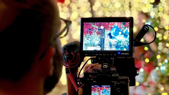Alex Brown using camera