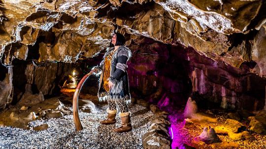 Cavewoman in cave