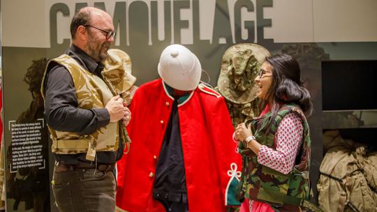 Two adults trying on York Army Museum Uniform2